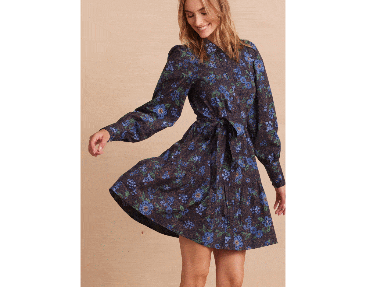 Model in dark floral tiered shirtdress