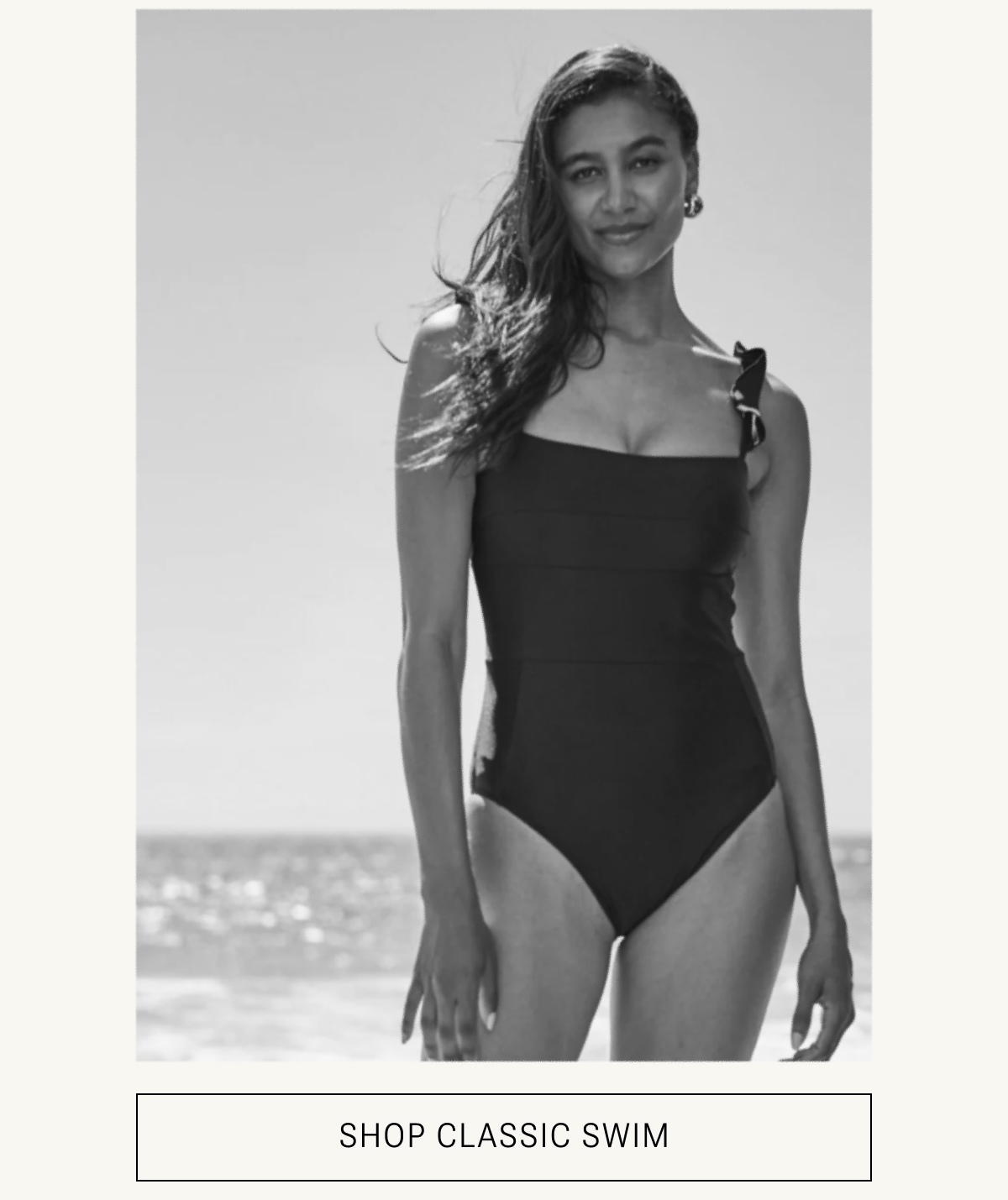 Model in black one piece swimsuit