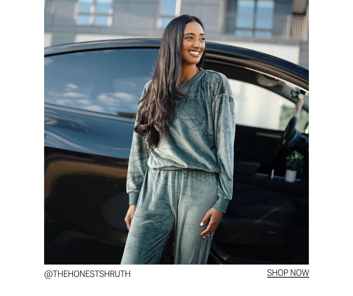 Model in olive green velour tracksuit