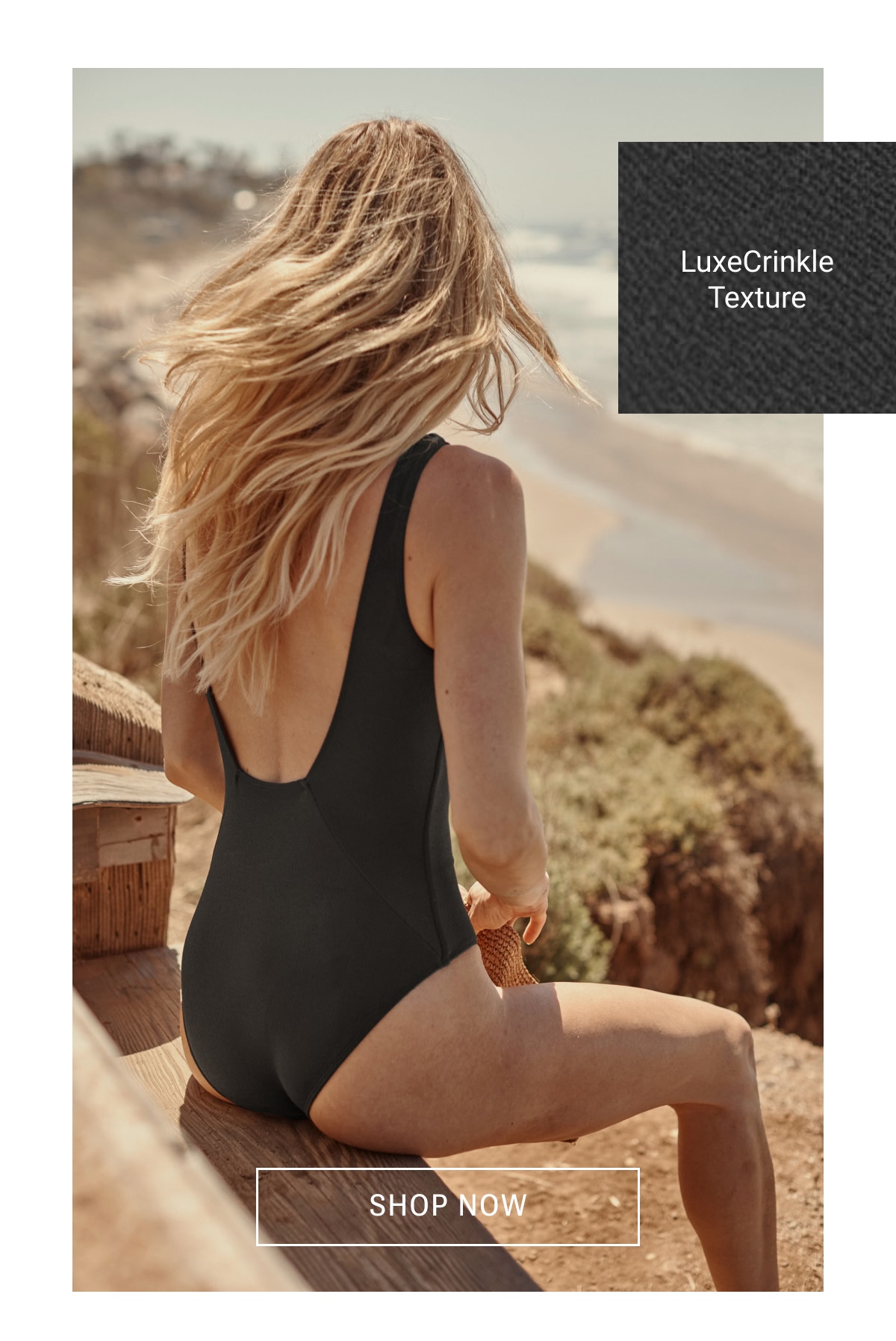 Model in black one piece swimsuit