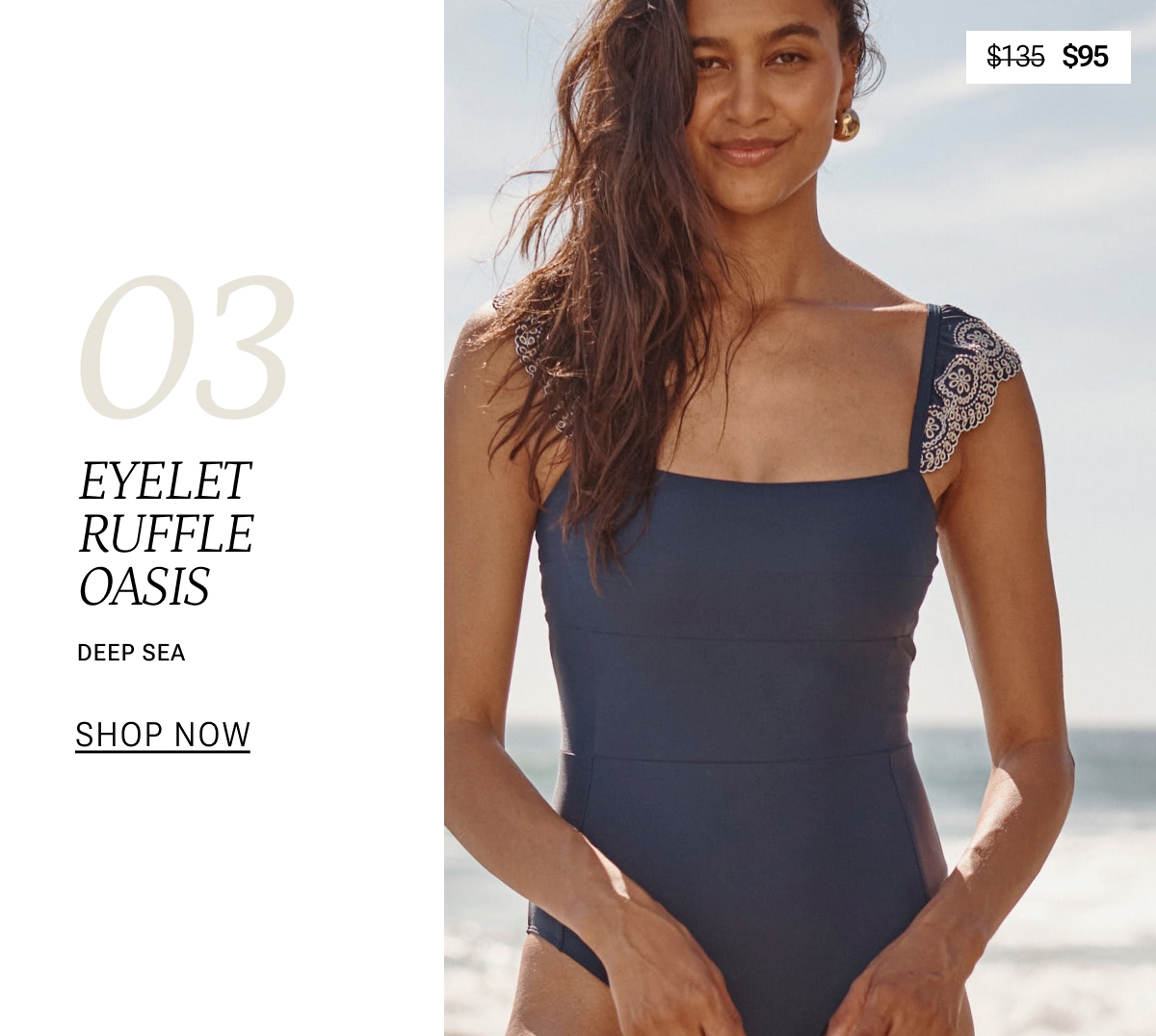 Model in navy blue eyelet one piece swimsuit