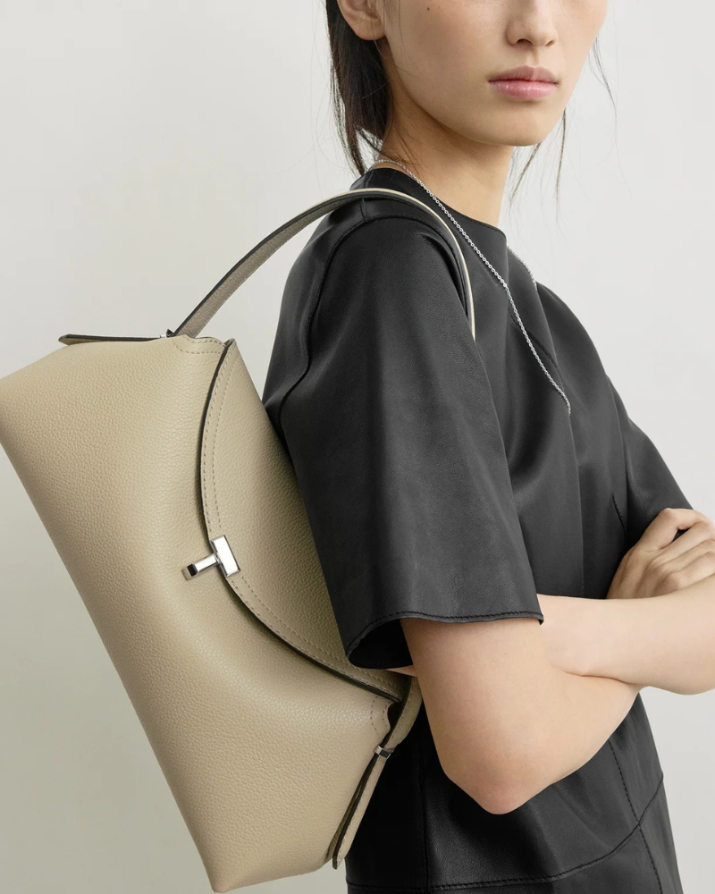 Totême T-Lock nappa leather top handle bag at Century 21 NYC designer handbag drop
