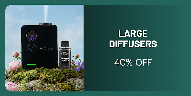 an image of a bottle of perfume sitting on top of a moss covered ground