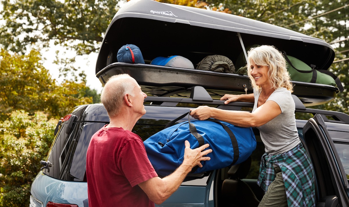 Couple loading up cargo carrier