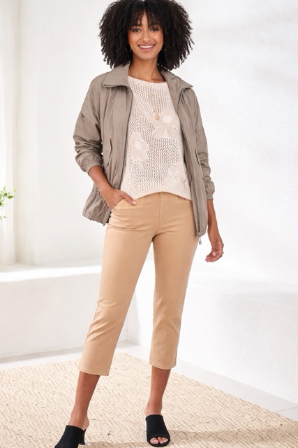 Woman in stylized beige outfit
