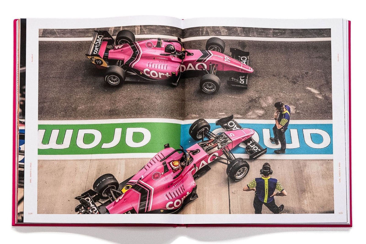 Open spread of an F1 coffee table book