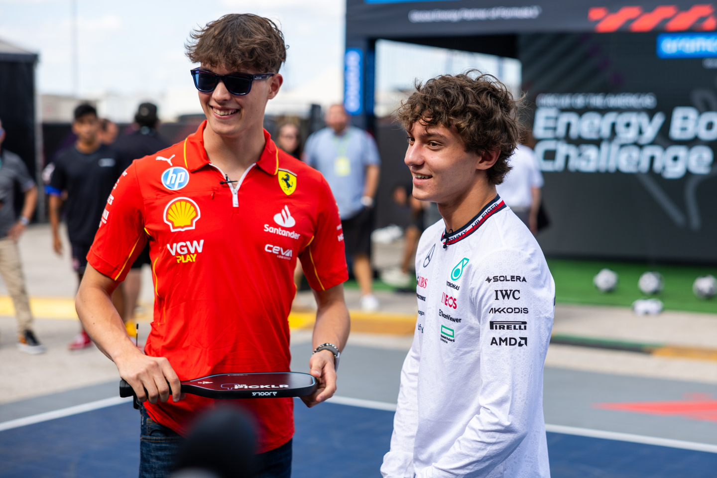 Oliver Bearman, Ferrari, and Andrea Kimi Antonelli, Mercedes-AMG, play pickleball in the paddock at the US GP 2024 