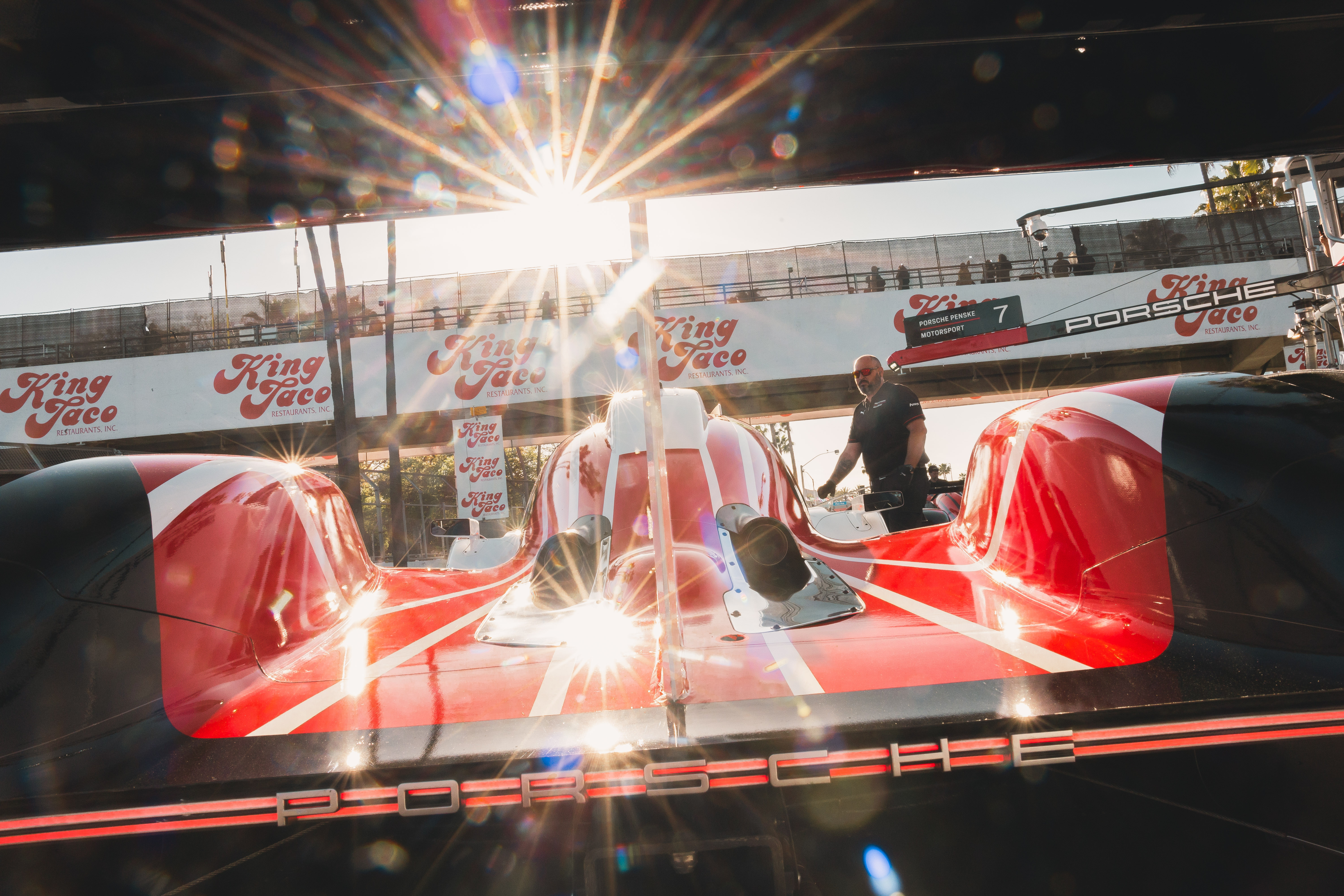 Behind the scenes, or rather, behind the tail of the Porsche 963 GTP car at Long Beach