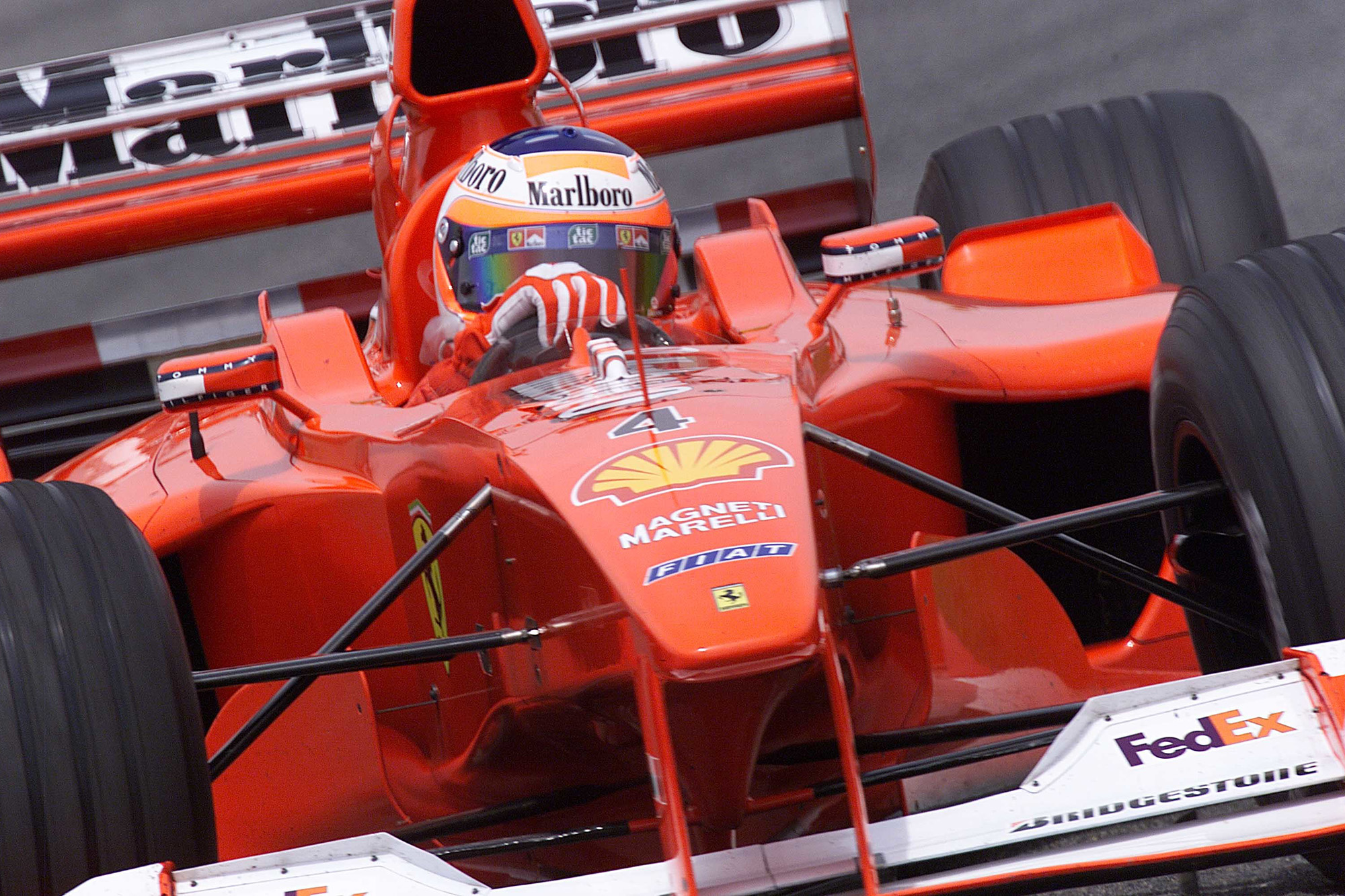 Michael Schumacher, Ferrari F1-2000, leads Mika Häkkinen, McLaren MP4-15 Mercedes on track at the Spanish GP, 2000 (with a V10)