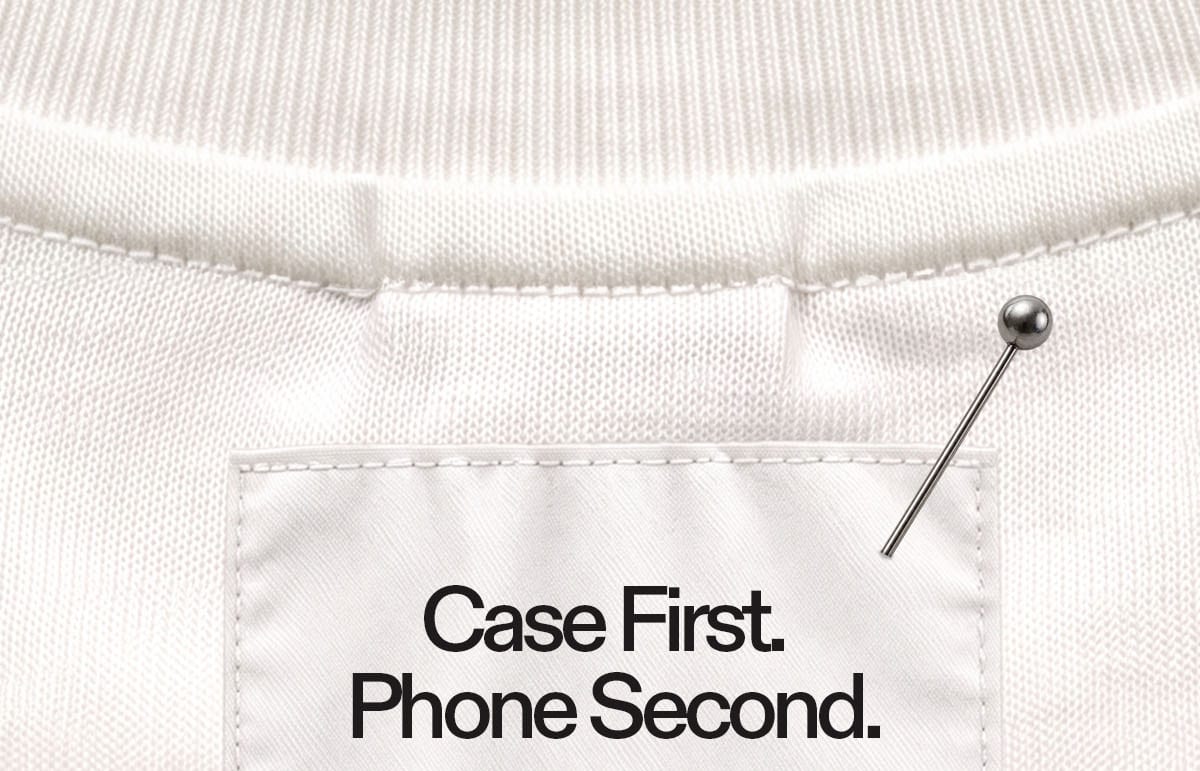 White ribbed fabric background with a pinned label partially reading “Case First. Phone Second.”