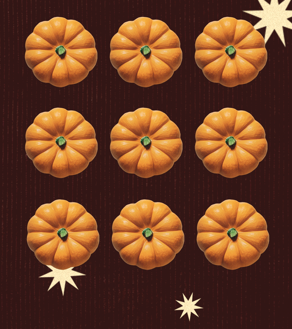Dark woodgrain background patterned with three rows of orange pumpkins and cream stars.