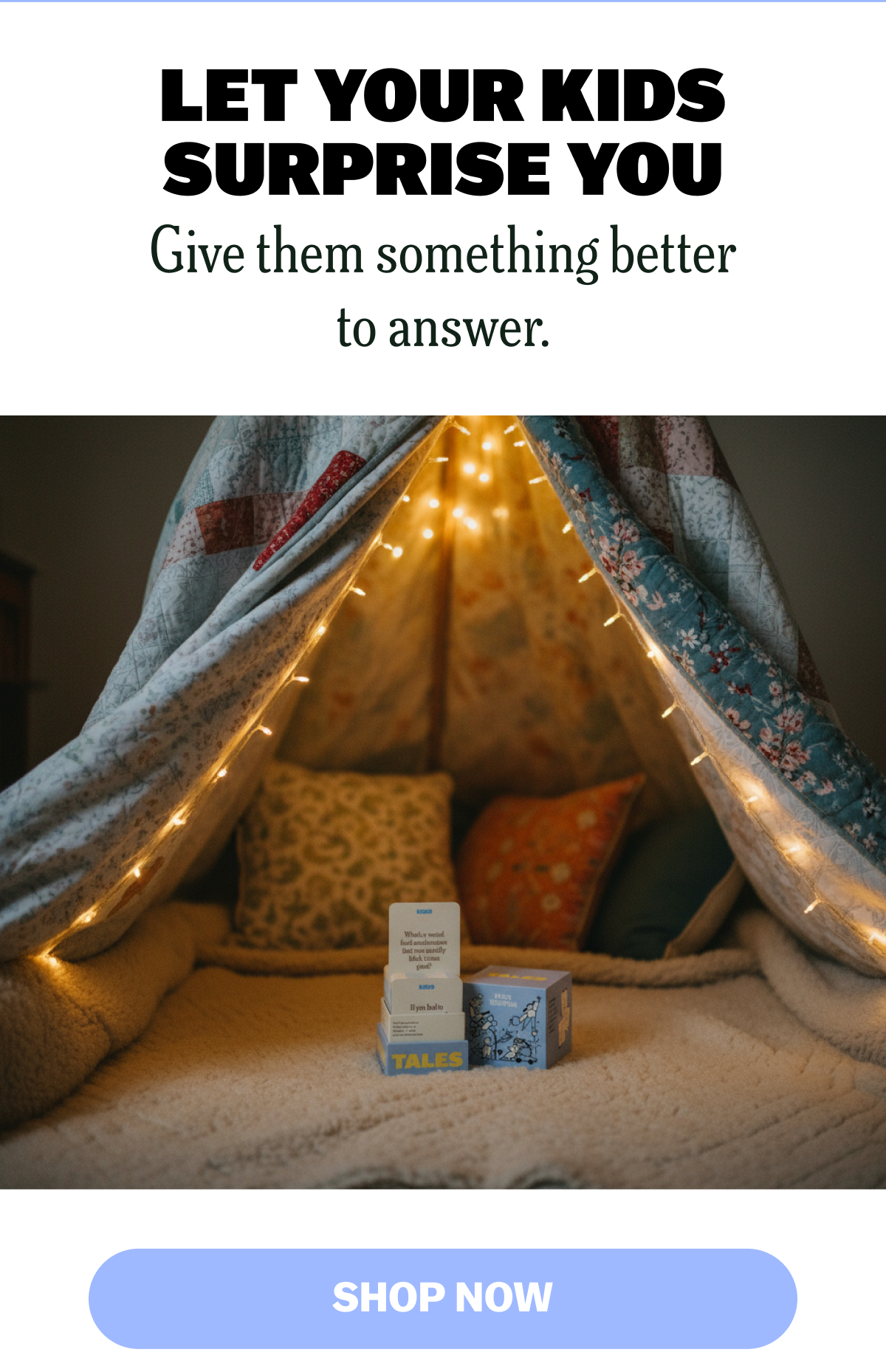 Cozy indoor fort with lights and games for kids.