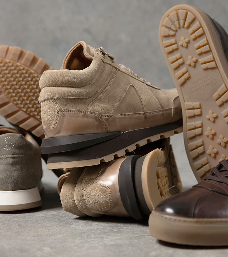 wet weather trainers with cleated rubber soles for grip