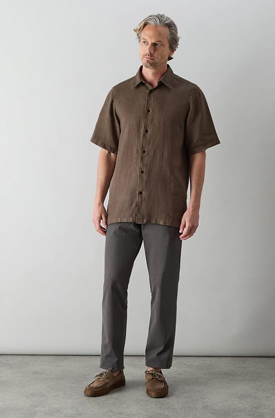 model wearing a linen shirts, chinos and suede espadrilles