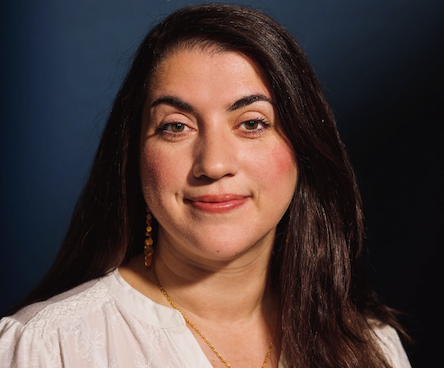 A portrait photo of Christina V. Theordoris smiling and looking into the camera
