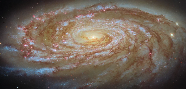 A spiral galaxy with a glowing center and red and blue dots scattered along its arms.