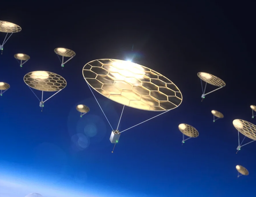 Artist's impression shows multiple small flat circular golden devices soaring on sunlight at the edges of Earth's atmosphere