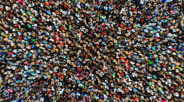 Big crowd of people in a top down view from drone.