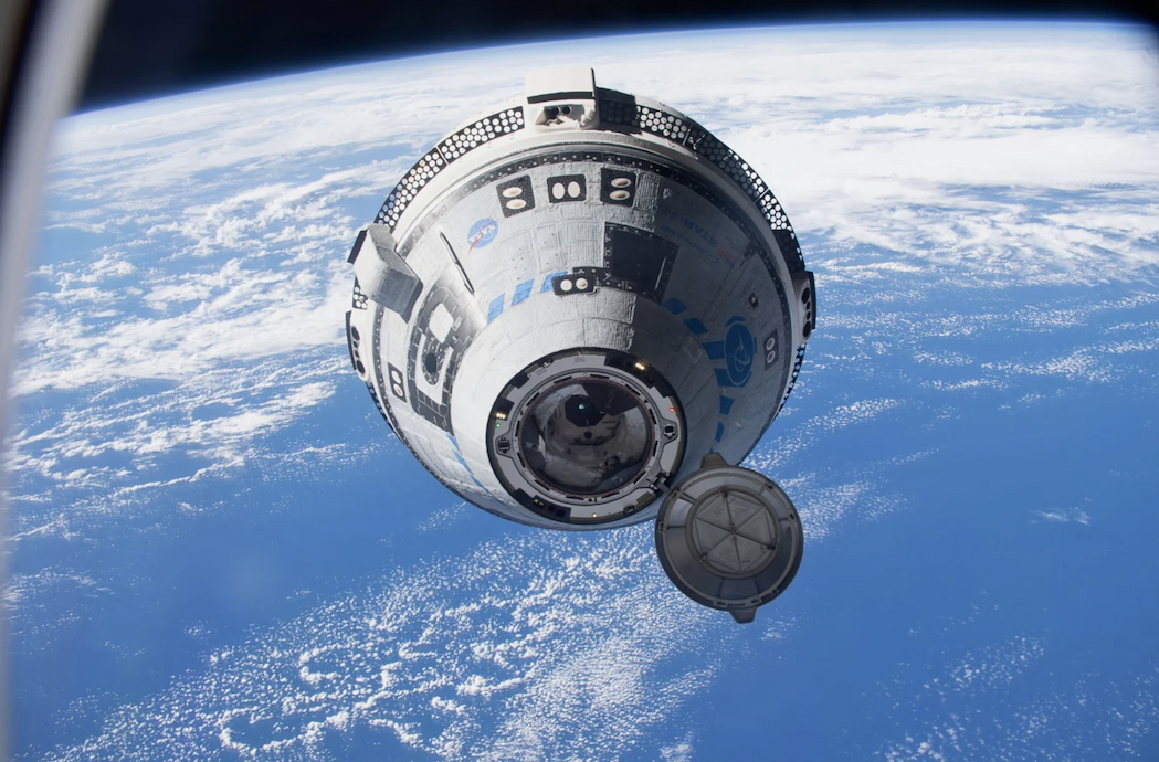 Boeing's Starliner craft floating above Earth in space