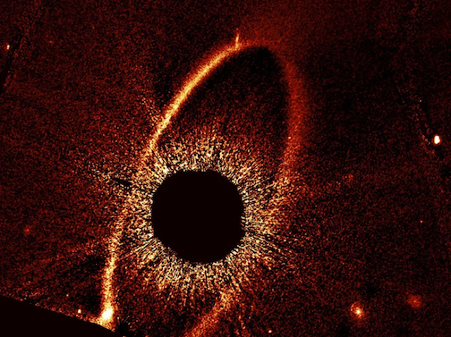This composite Hubble Space Telescope image shows the debris ring and dust clouds cs1 and cs2 around the star Fomalhaut.