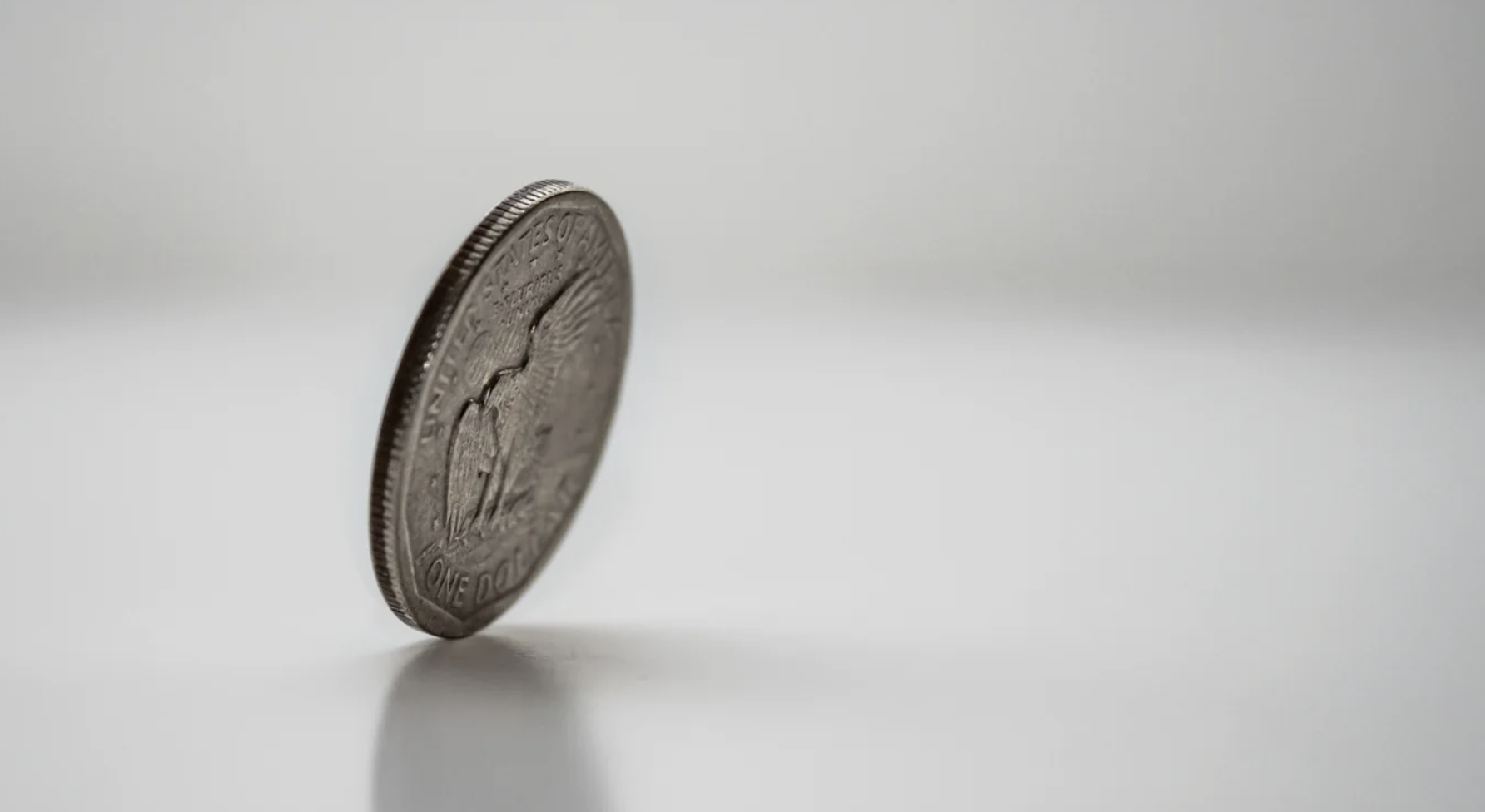 A coin balancing on its edge