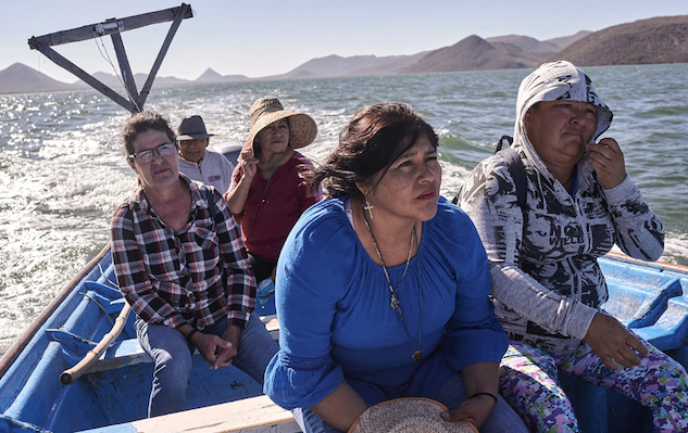 Melina Maldonado Sandoval sitting in a boat with other three women and a man at the back."