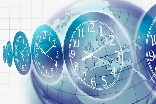 A conceptual illustration showing clocks set to different times in front of a globe