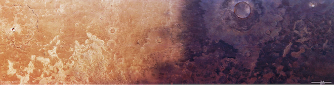 A satellite image of the surface of Mars. The right half of the image is covered in darkness.