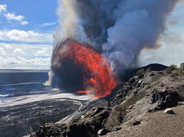 A giant fountain of lava streams out of a volcanic crater