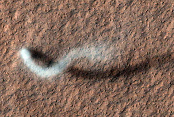 A white swirl represents a dust devil on Mars.