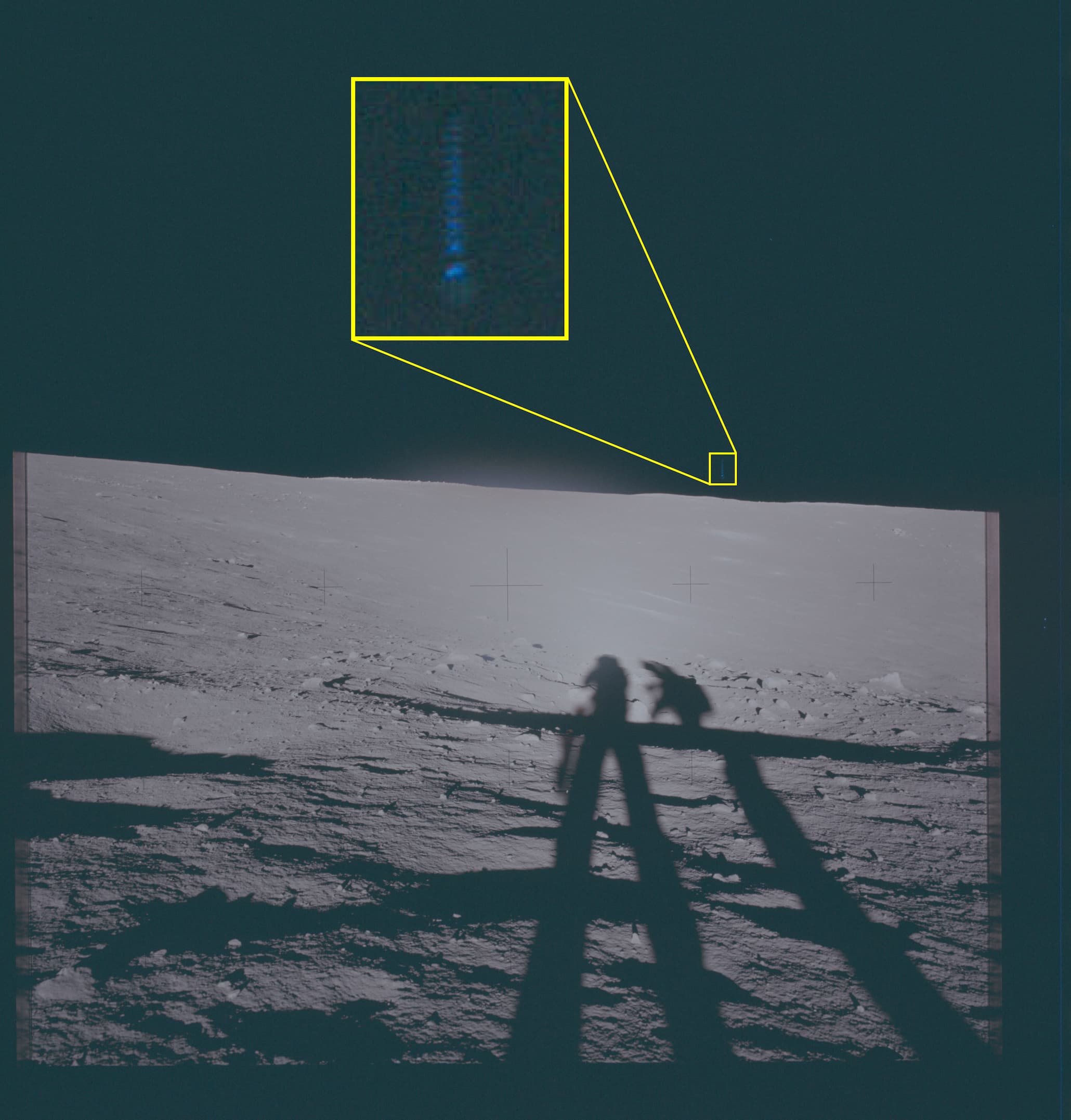 A picture of the lunar surface with a highlighted frame. Inside the highlighted frame is a blue object suspended in the air.