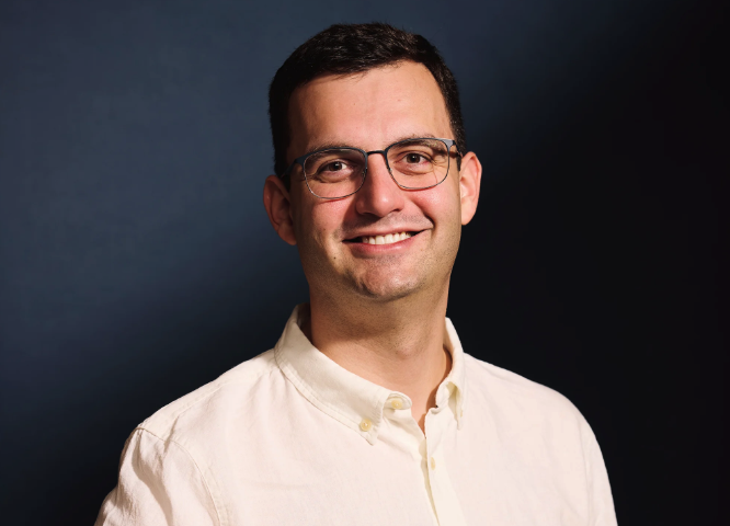 A portrait photo of Adam Bowman