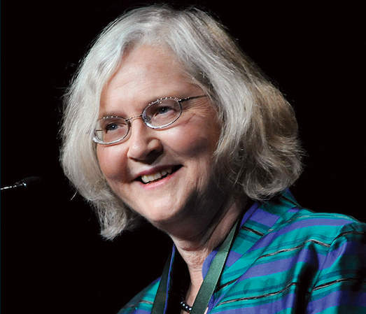 A photo of Elizabeth Blackburn on a black background