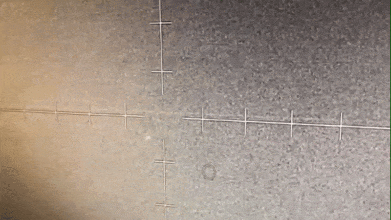  grainy target display screen showing a small rounded light near the target