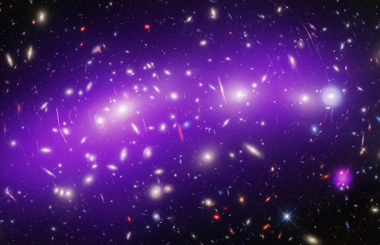 A sprawling galaxy cluster in a purple cloud