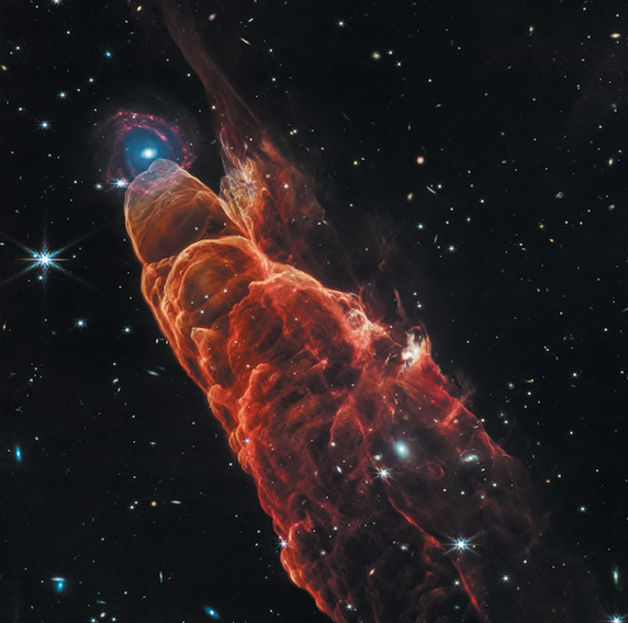A tall cylindrical column of red dust in space