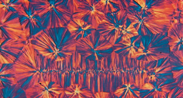 Psychedelic-looking crystal structure in coral and turquoise
