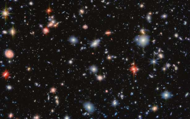 A space image showing the Hubble Ultra Deep Field, through the eyes of two instruments on the James Webb Space telescope.