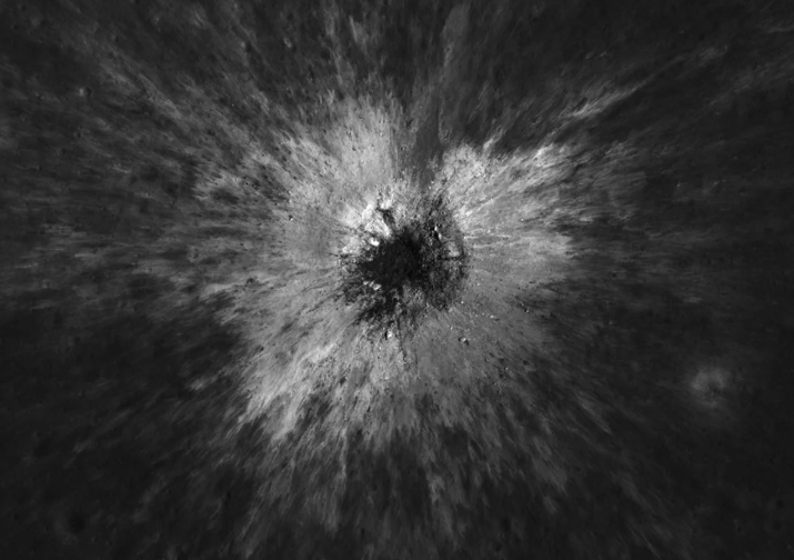 Black and white image of an impact crater on the lunar surface