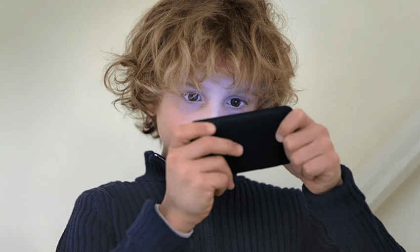 Young child holding a cellphone