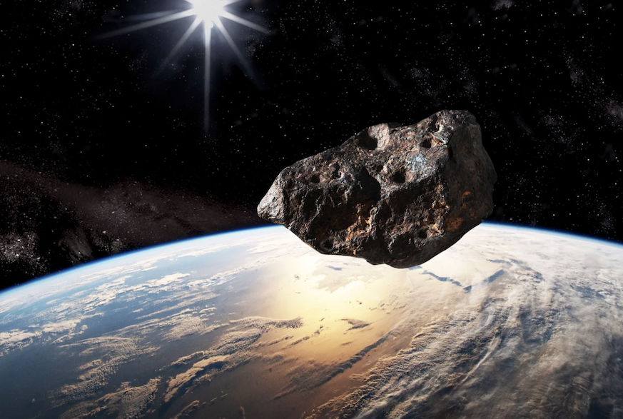 Artist's concept of an asteroid flying above Earth.
