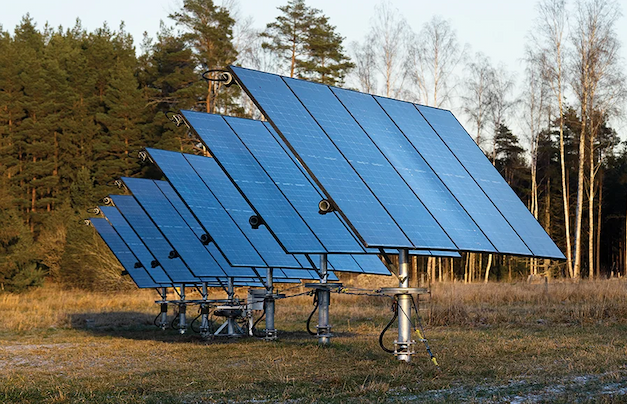 A set of solar panels mounted on poles at a 45 degree angle facing the sun. 