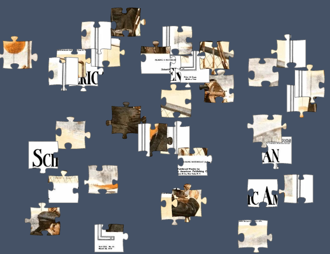 White, slate and tan colored puzzle pieces arrayed on a gray background