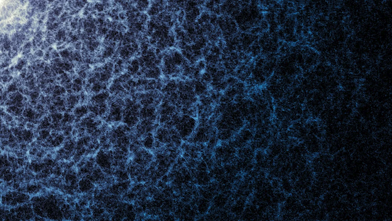 A small portion of DESI’s year-five map in which the large-scale structure of the Universe, created by gravity, is visible. Each dot represents a galaxy. The denser areas indicate regions where galaxies and galaxy clusters have clumped together to form the strands of the cosmic web. Also seen are large voids between the filaments.
