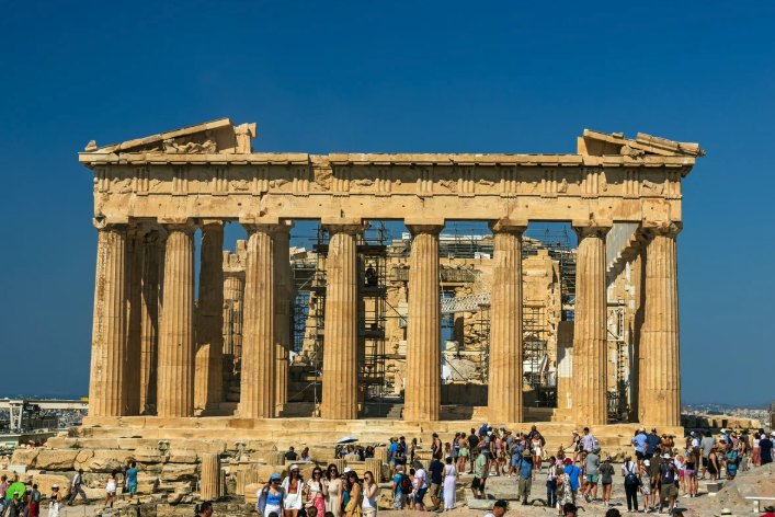 The parthenon, in Greece, surrounded by tourists