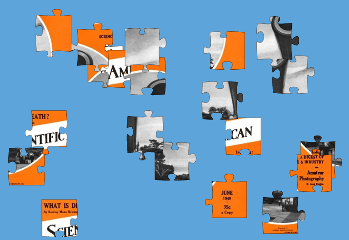 Black, white and orange puzzle pieces arrayed on a blue background