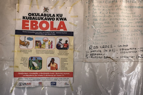 Poster with the test "Ebola" in red alongside several phone numbers