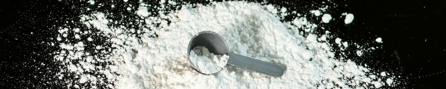 Creatine scoop on table