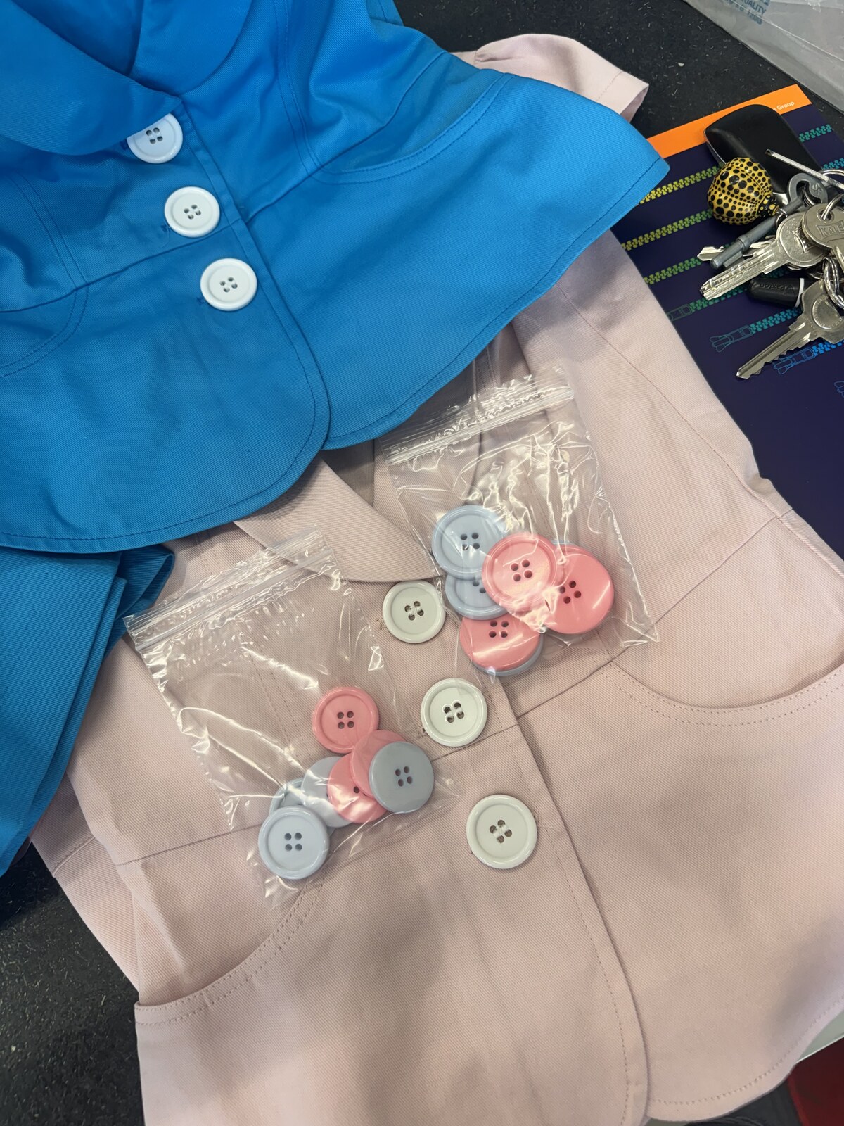 Mixed pink, blue and white buttons beside the Sprinkles samples