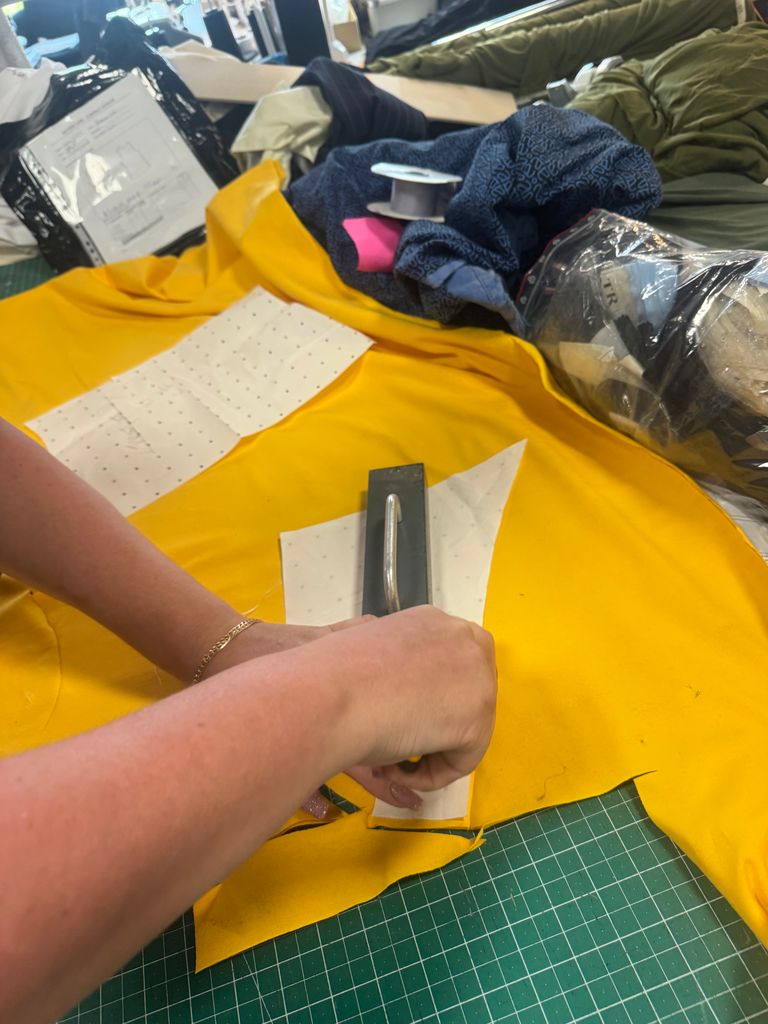 Seamstress cutting the banana split yellow top